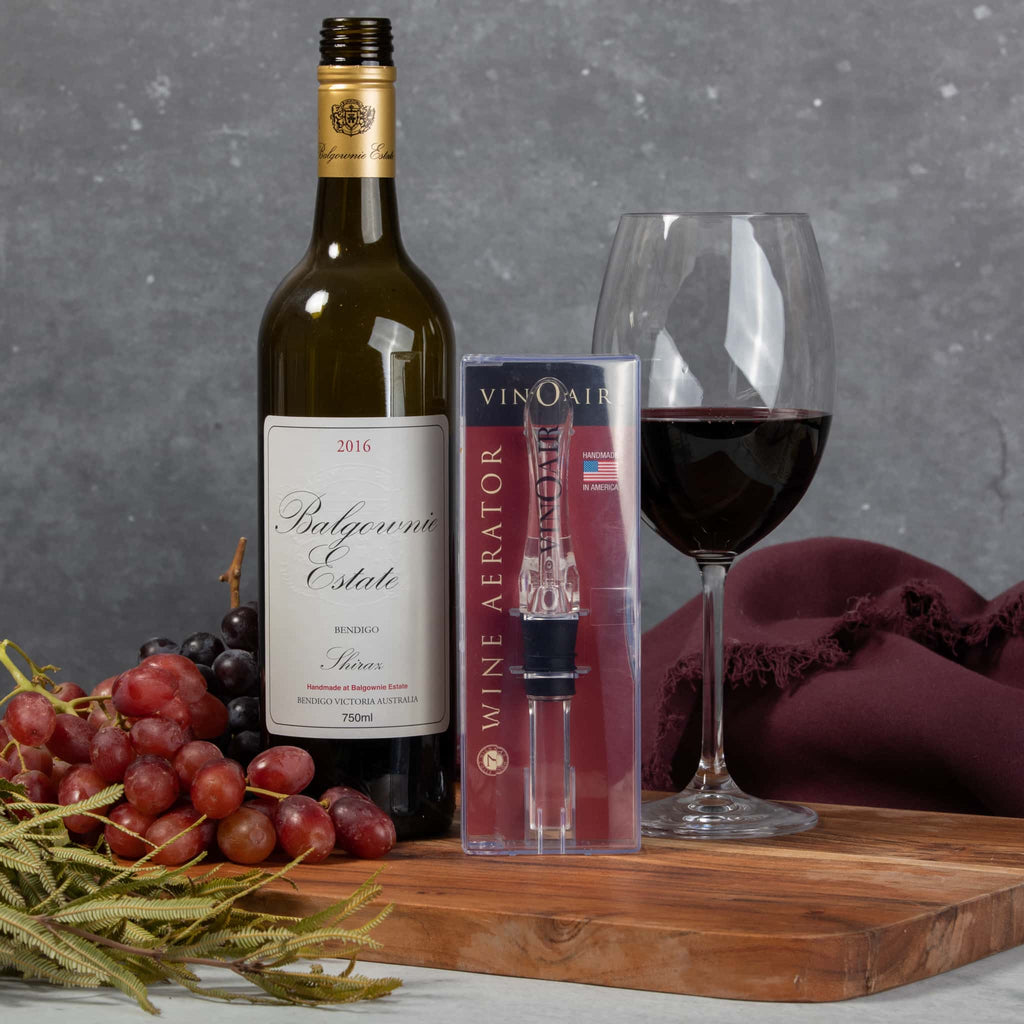 VinOair wine aerator with bottle and grapes